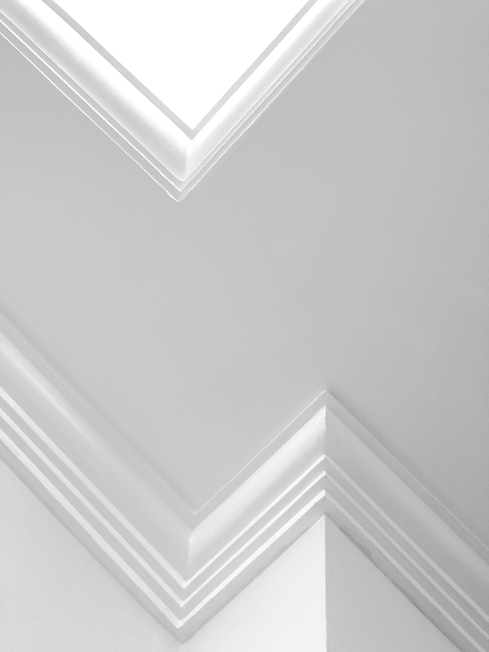 low angle view of a white ceiling and walls